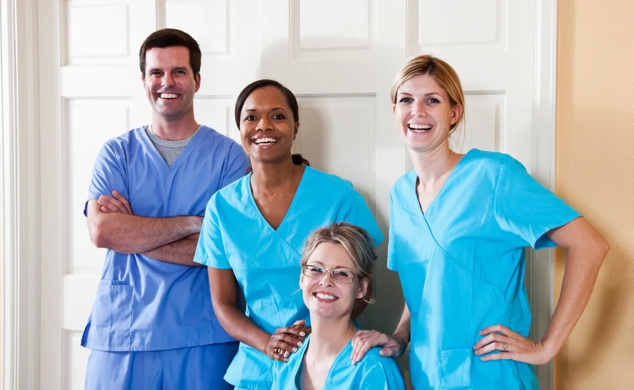 family medicine clinic team in blue scrubs