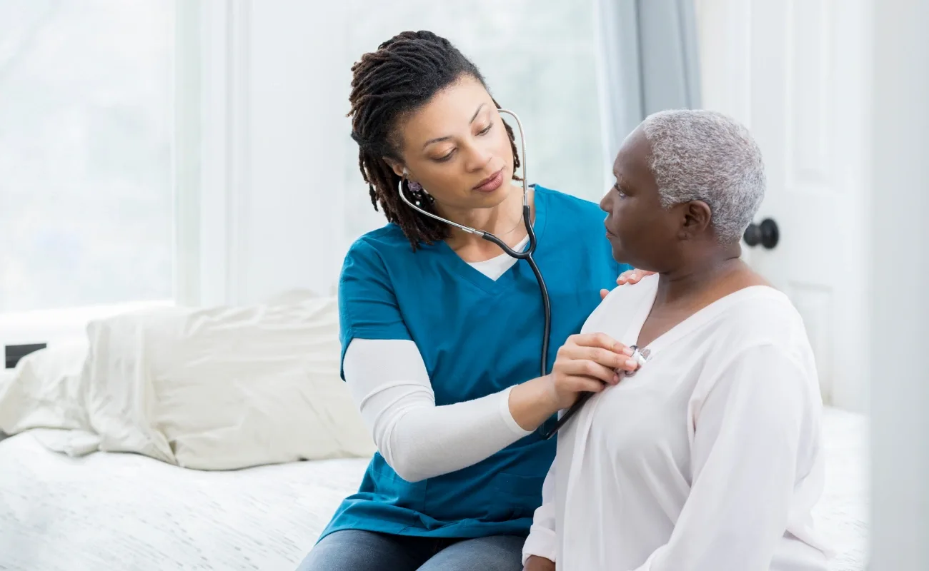 family medicine physical exam with stethoscope for senior patient